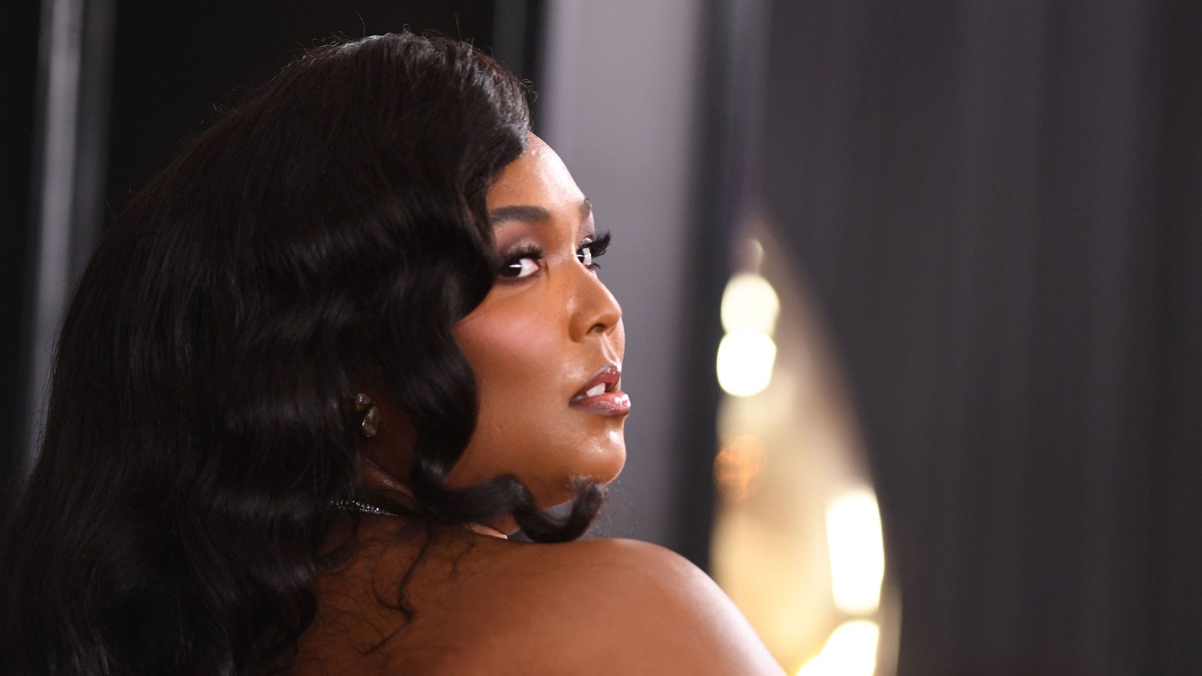 Lizzo poses at the Grammy Awards