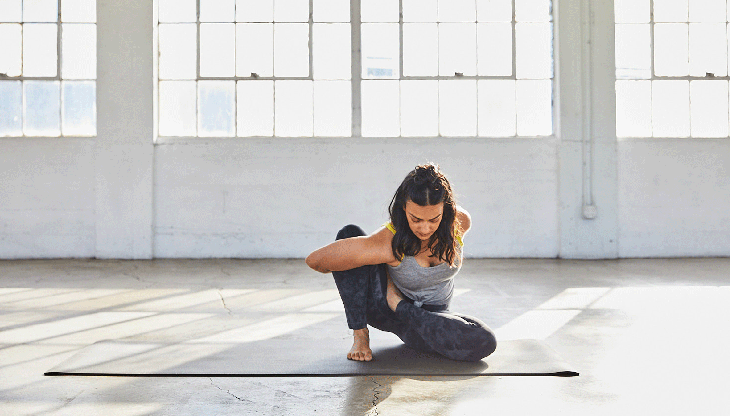 Premium Photo | Beautiful woman sitting in lotus position on the floor,  putting her hands on her knees, enjoying meditation, doing yoga at home.