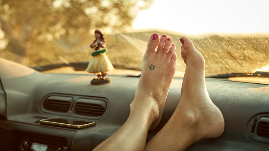 Woman's feet on the dashboard