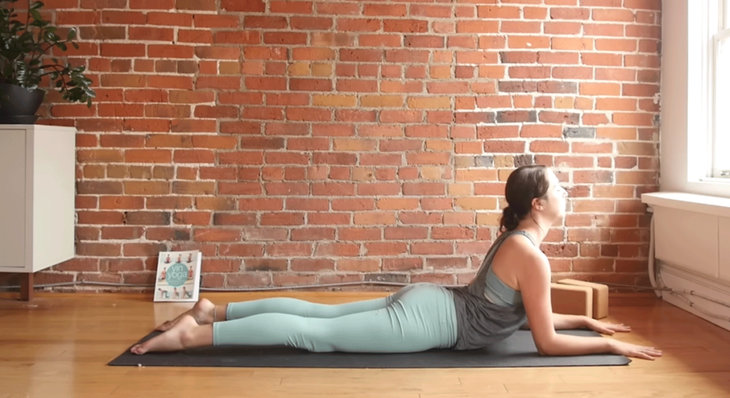Kassandra Reinhardt practicing and teaching Sphinx Pose as part of a full-body stretching routine