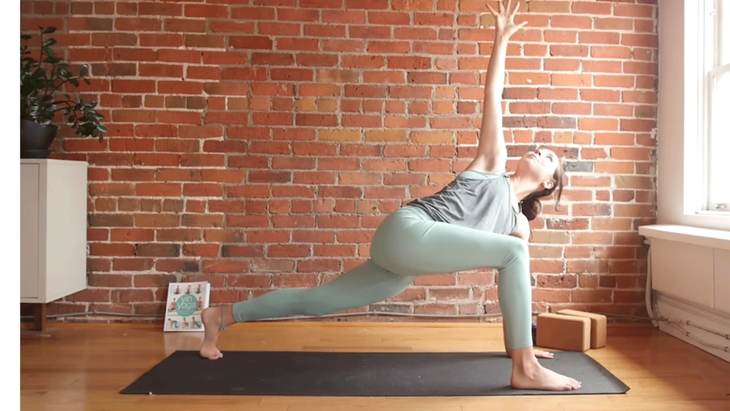 Cassandra Reinhardt teaches yoga in twisting lunges