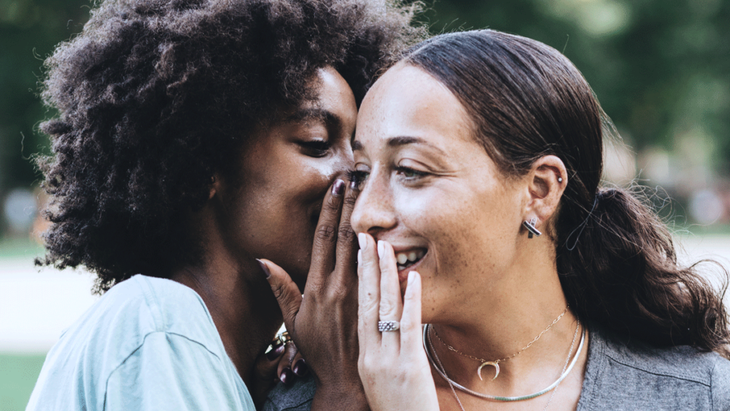 Two women are whispering