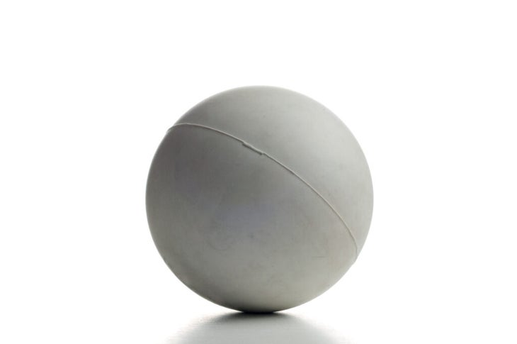 Lacrosse ball on a white background.  It can be used to relieve muscle pain.