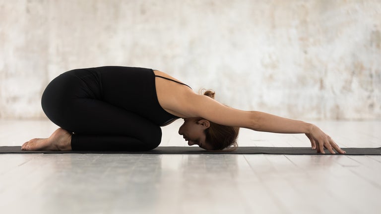 How to Stretch Your Lower Back in Yoga—Without Standing Up