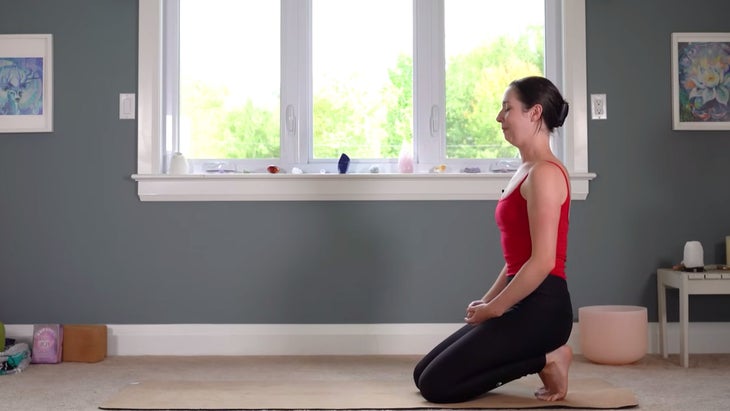 Woman sitting back on her heels with her toes tucked