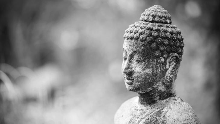 Buddha statue with a serene expression on their face during meditation.