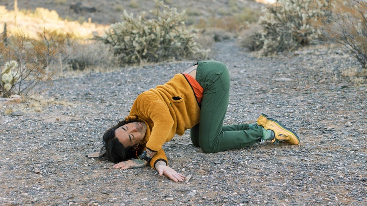 backpacker practicing yoga on a trail in the Arizona desert