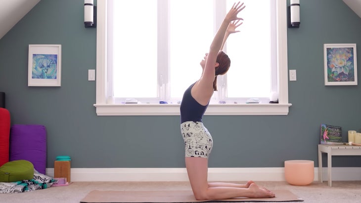 yoga instructor demonstrating dynamic camel pose standing