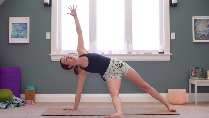 yoga instructor demonstrating fallen triangle