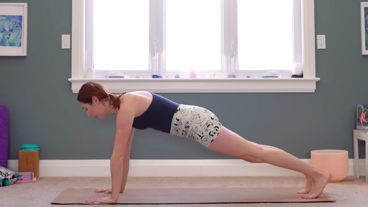 yoga instructor demonstrating plank pose