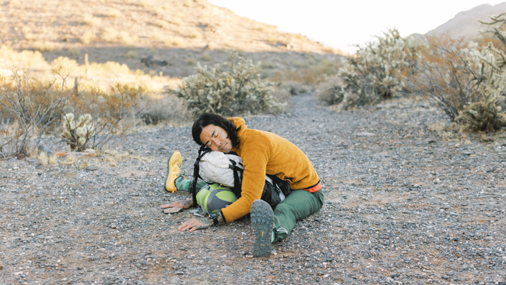 Person practicing yoga for backpackers along the circumference trail of Piestewa Peak in Phoenix