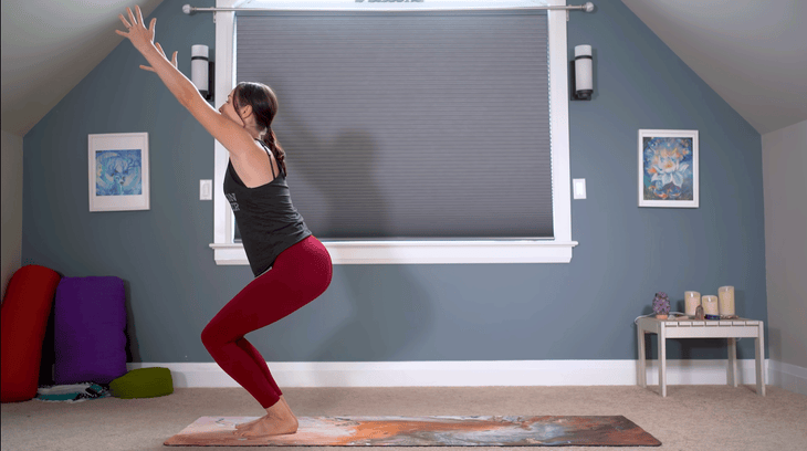 Woman practicing Chair Pose in yoga