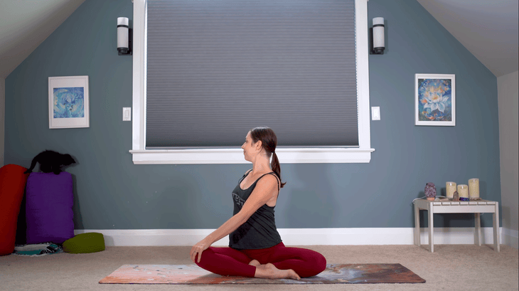 Yoga With Kassandra practicing 30-minute yoga and a seated twist