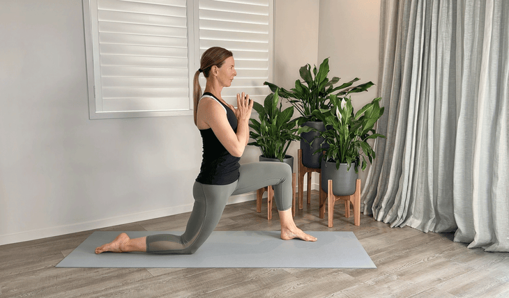 Woman kneeling in a low lunge