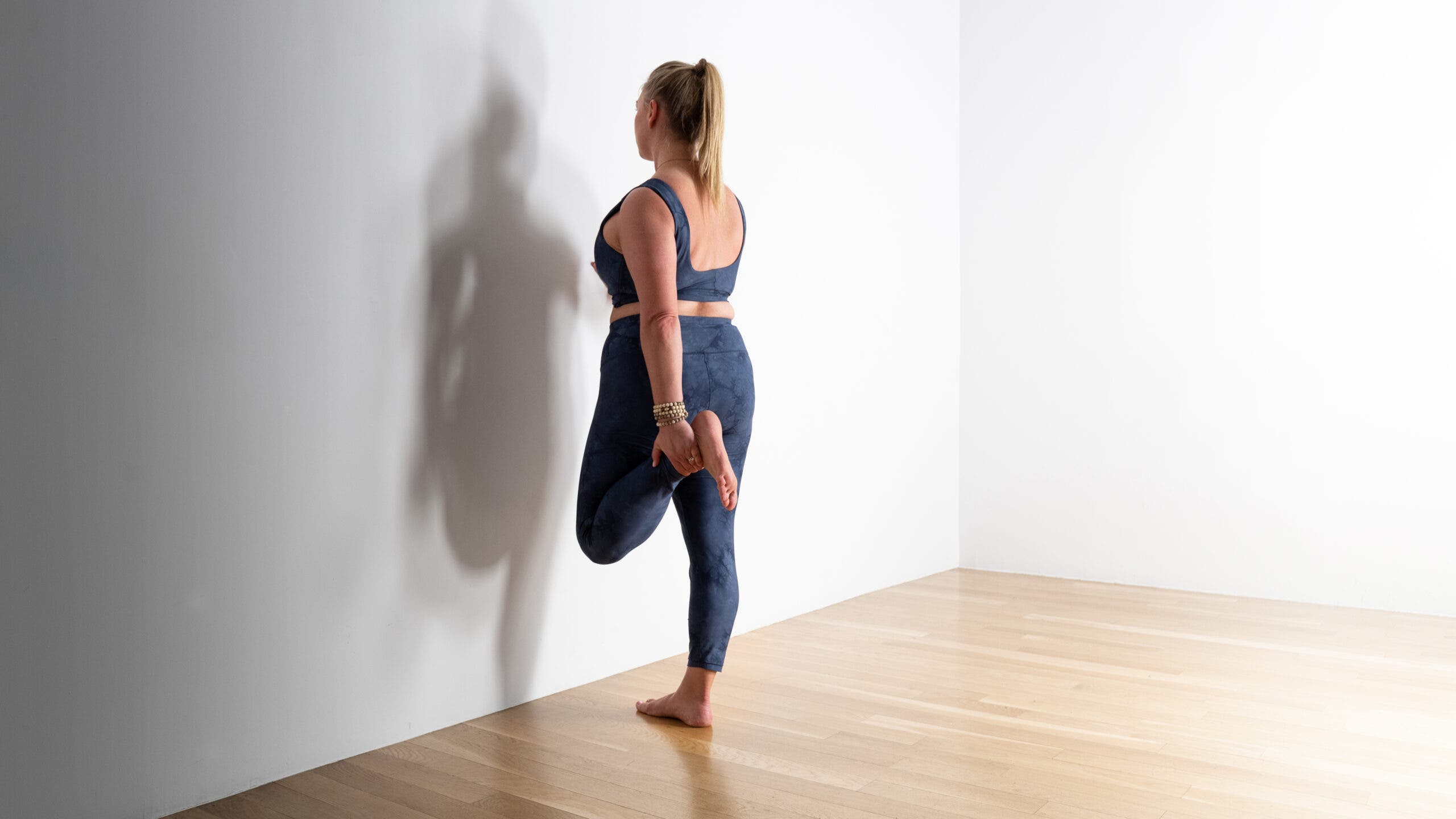 King Arthur's pose practiced against a wall.