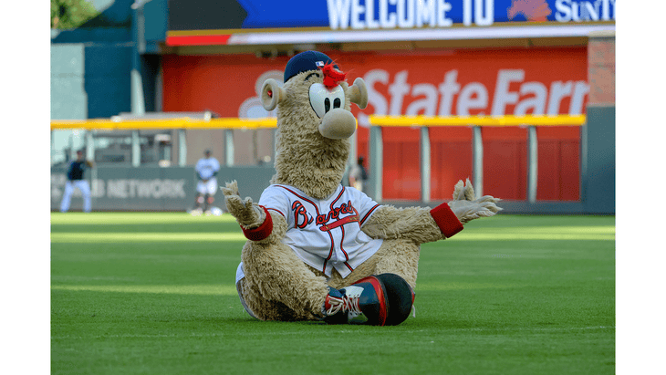 Atlanta Braves mascot Blooper practicing yoga and baseball by meditating on the infield