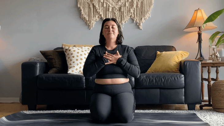 Woman kneeling with her toes tucked and her hips on her heels