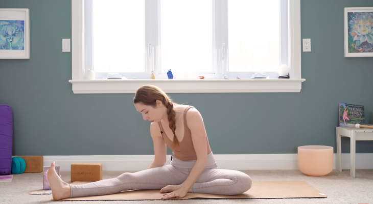 Woman seated in Half Butterfly Pose in yin yoga