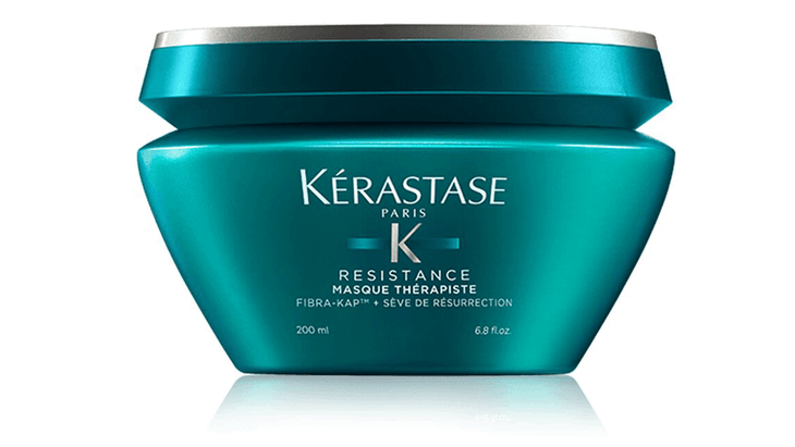 A dark turqouise container of Kérastase hair mask