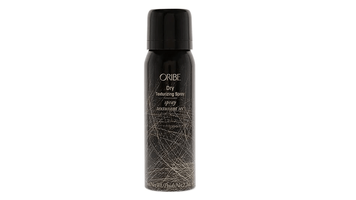 Oribe dry texturizing spray bottle on a white background