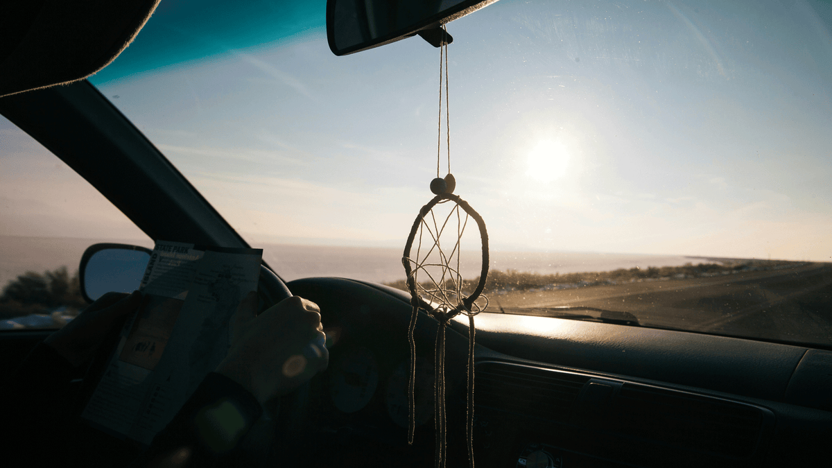 9 Simple Stretches You Can Do From a Car, Plane, Bus, or Train