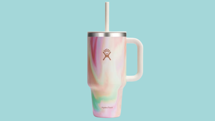 A handled tumbler from Hydro Flask with a straw and pastel pattern