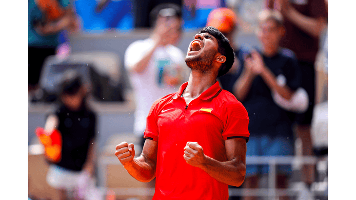 Tennis player Tommy Paul at the Paris Olympics 2024 screaming after winning a match.