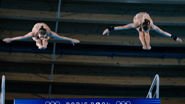 Two divers—Jade Gillet and Emily Halifax of France—competing in the Women's Synchronized Diving at the Paris Olympics 2024