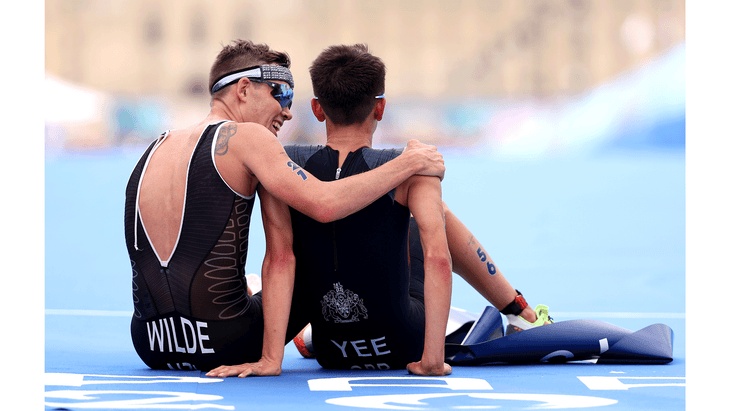 Two triathletes at the Paris Olympics 2024 after winning the gold and silver medals