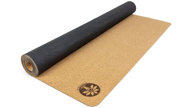 a partially unrolled cork yoga mat