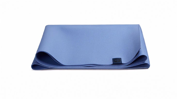 a purple travel yoga mat folded into a rectangle