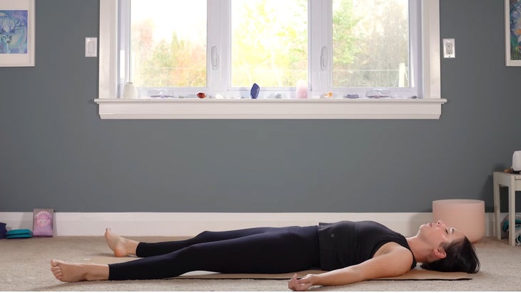 woman does yoga for core strength on a mat