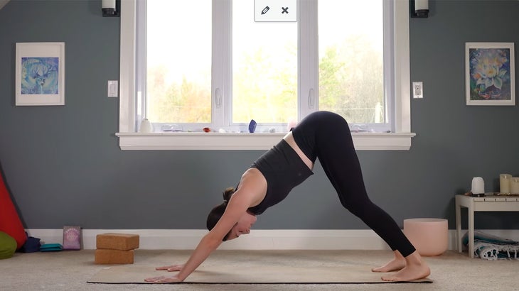 woman does yoga for core strength on a mat