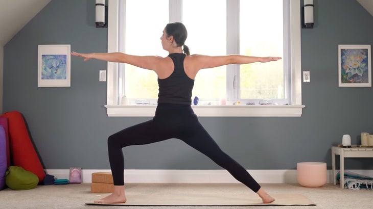 woman does yoga for core strength on a mat