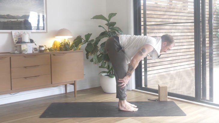 Man strengthening his lower back with yoga poses