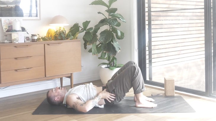 Man strengthening his lower back with yoga poses