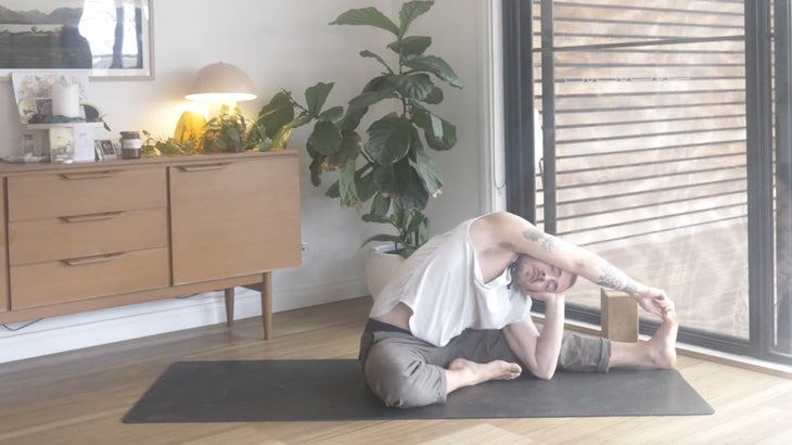 Man strengthening his lower back with yoga poses