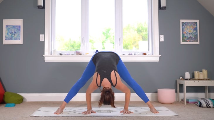 woman practicing gentle yoga poses on a mat