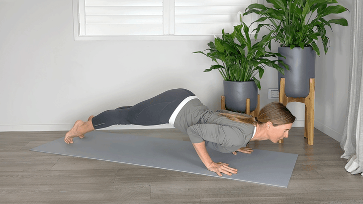 Woman in Chaturanga with her chest too low and her hips too high