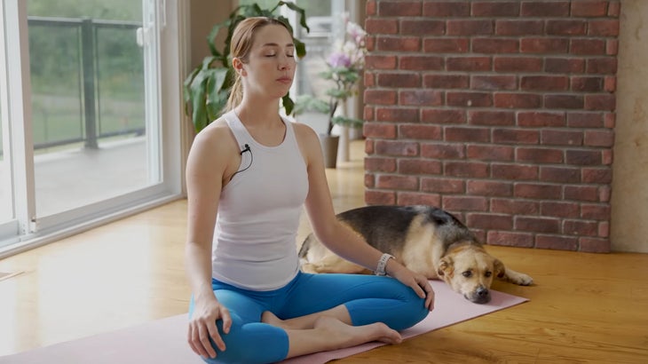 woman on a yoga mat practicing for focus