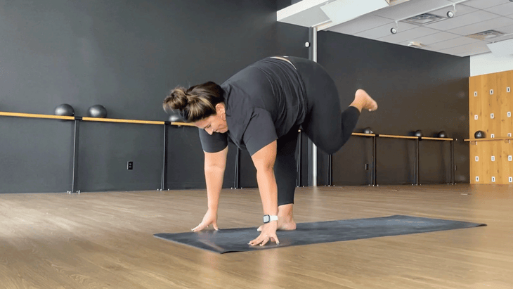 Teacher in Shiva Squat on a mat