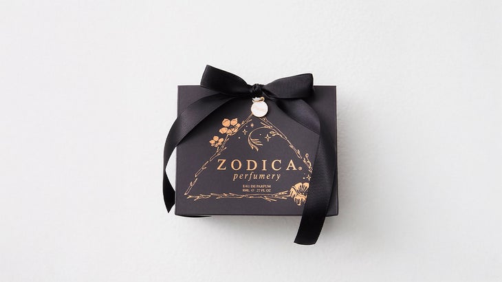 box of Zodica Perfumery perfume with a black bow