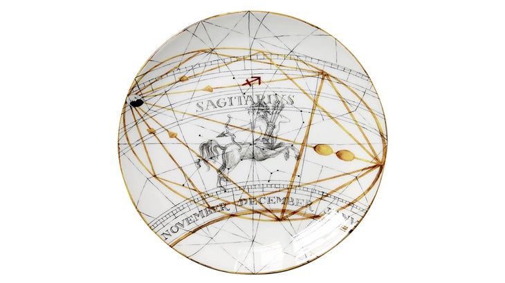 zodiac dessert plate with a Sagittarius logo and gold streaks