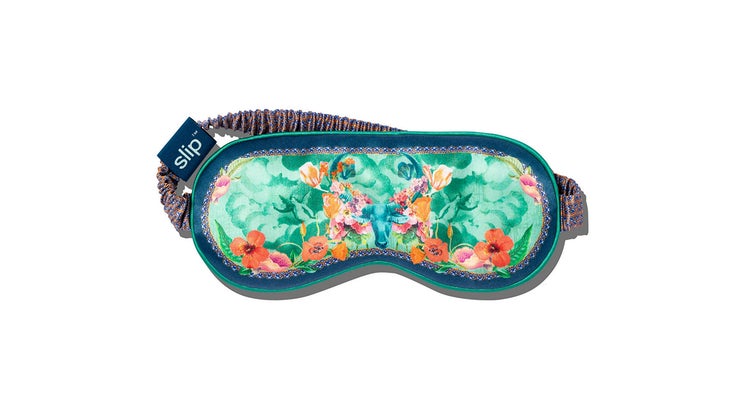 sleep mask with a taurus bull print and green and orange florals