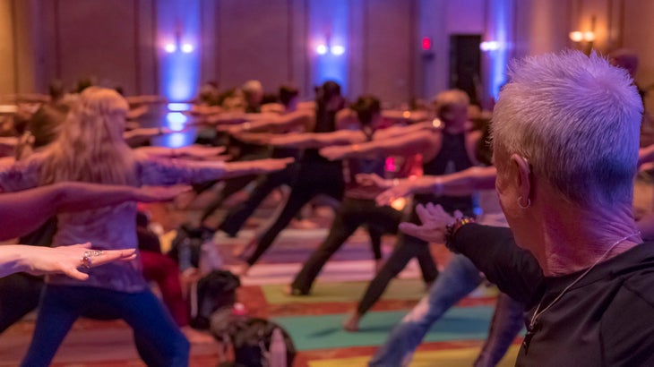 People at a yoga festival in Warrior 2