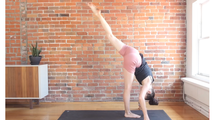 Woman balancing on one leg in Standing Splits