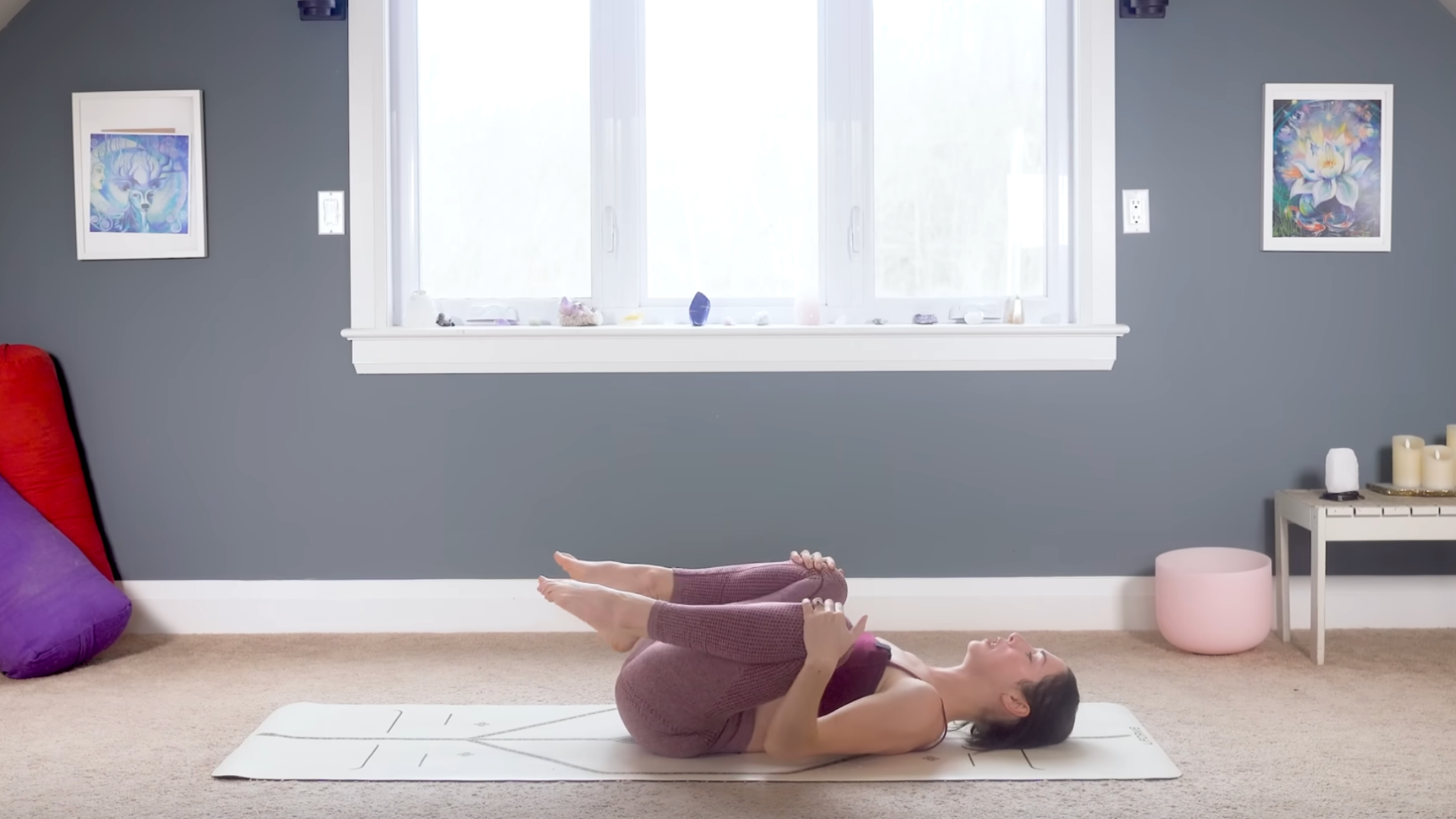 Woman lying on her back on a yoga mat