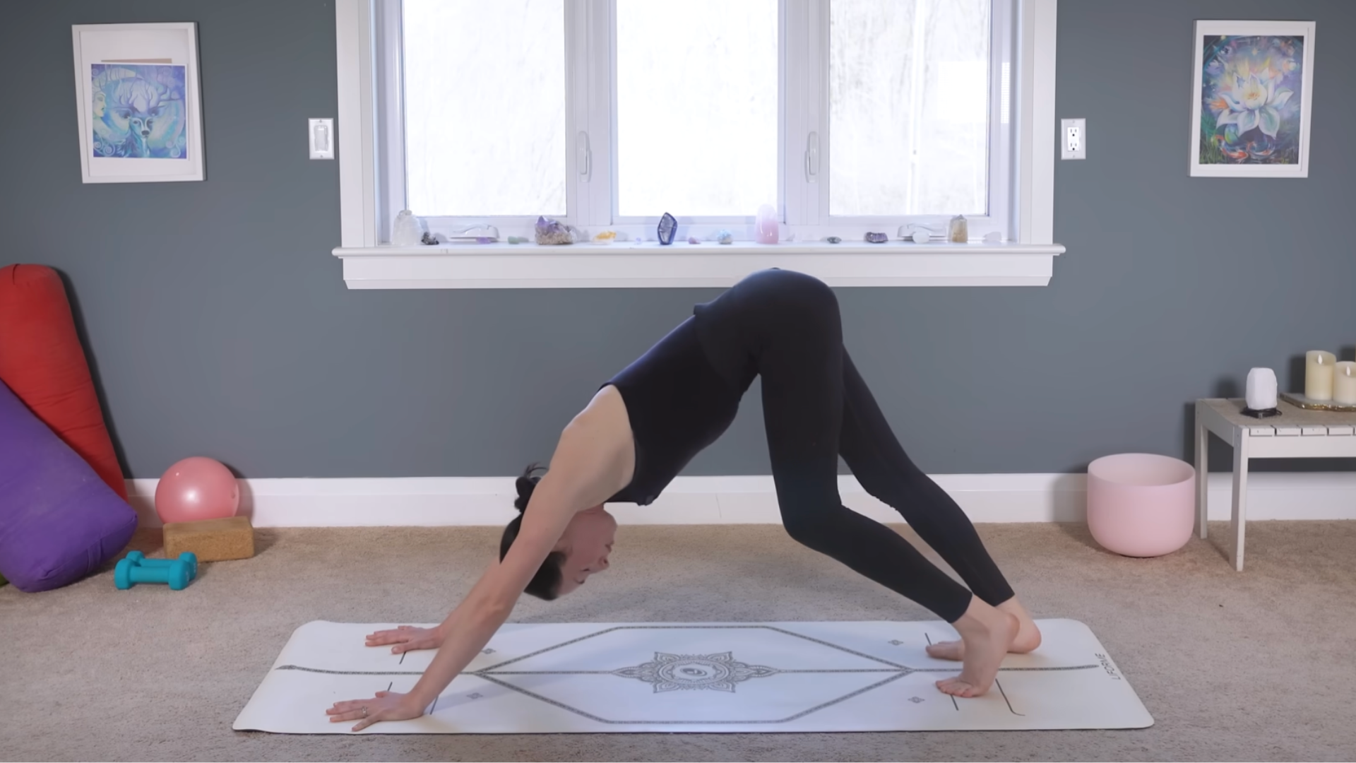 Yoga teacher practicing Down Dog during a demo of a 10-minute morning yoga routine
