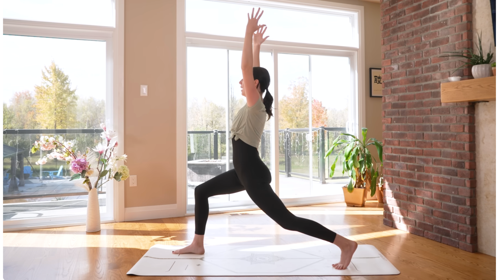 Woman in high lunge on a yoga mata