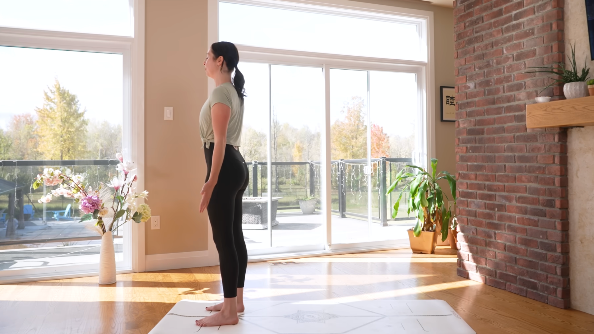 Woman standing in Mountain Pose on a yoga mat